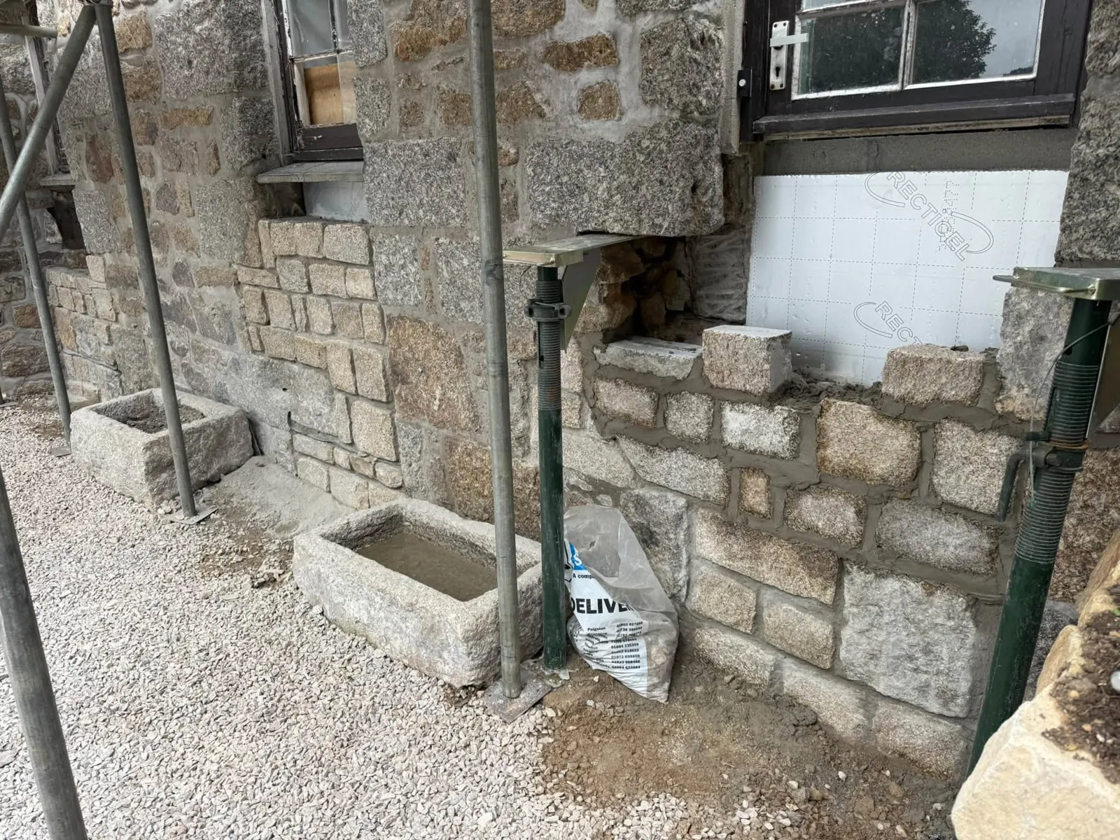 Remedial stonework under a cottage window