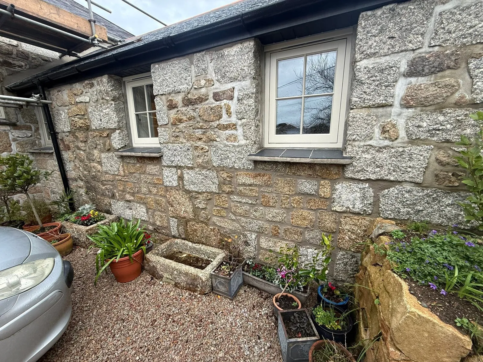 Repointed granite cottage front