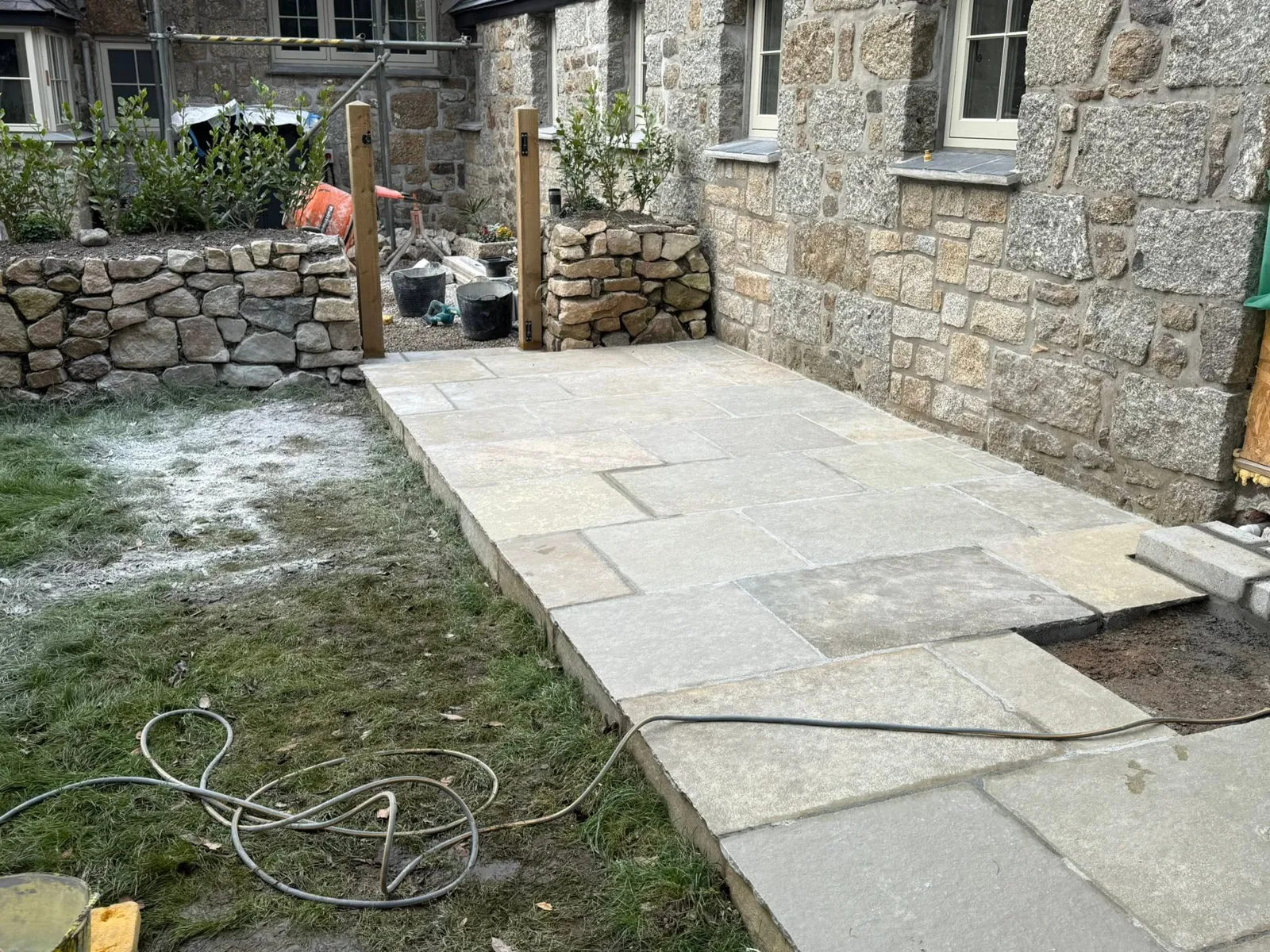Stone path beside a granite cottage