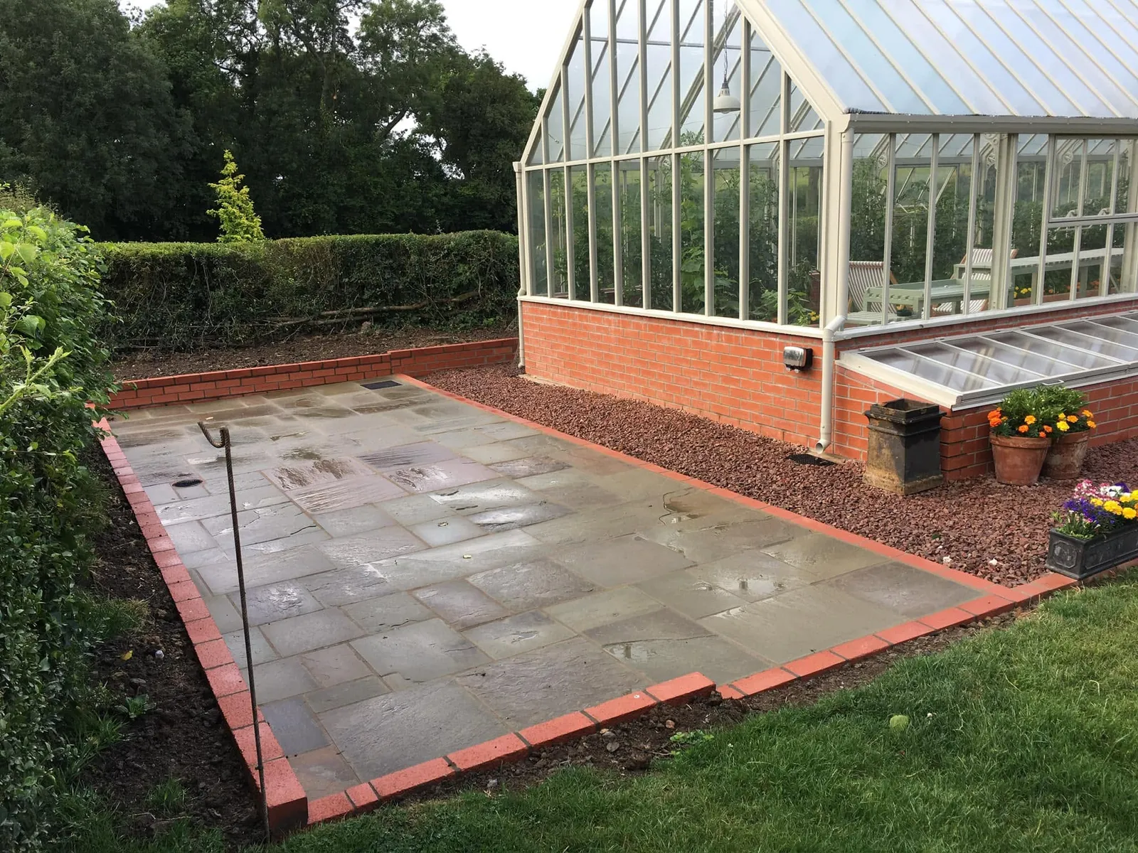 Paved patio with a brick edge