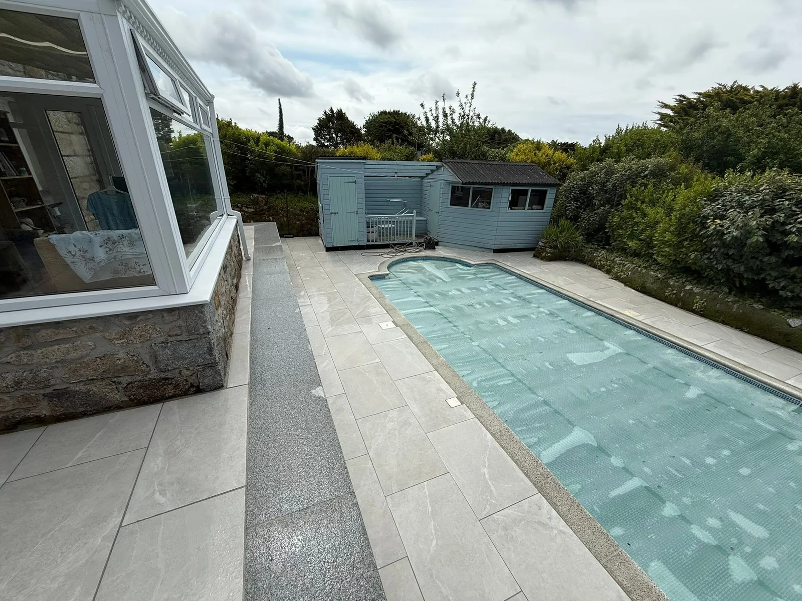Paved surround to a swimming pool
