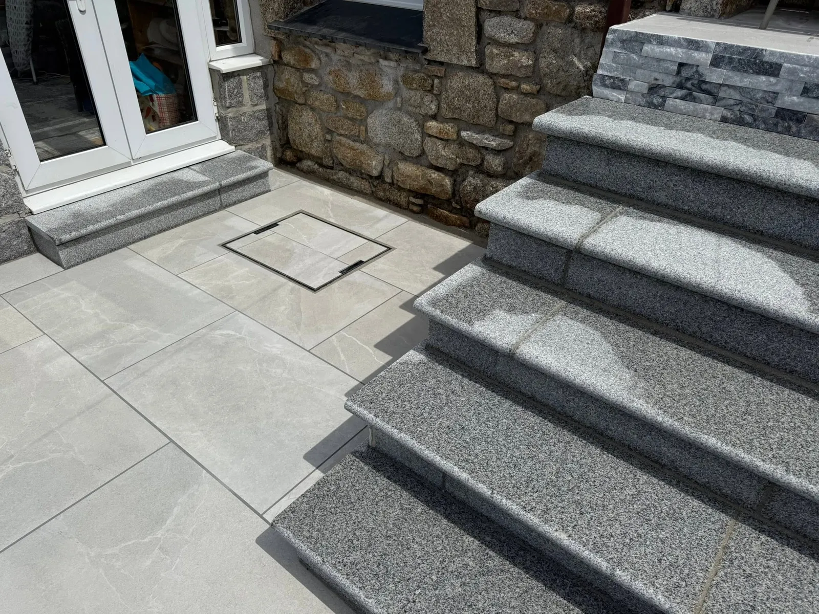 Stone steps and paved landing