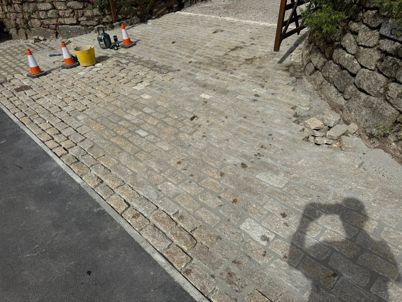 Granite setts going down on a driveway apron