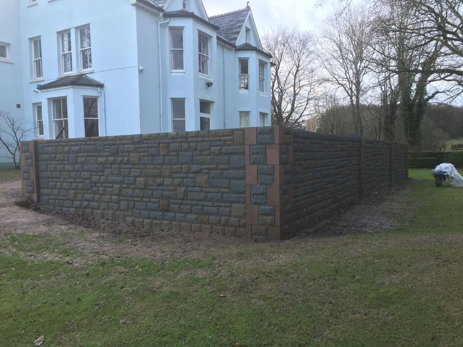 Stone boundary wall around a lawn